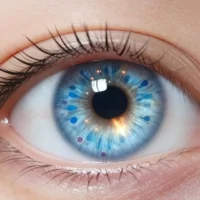 A bright, futuristic eye with microscopic cells repairing it, symbolizing a breakthrough in medical technology, with a subtle glow of hope.