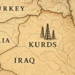 A detailed historical map showing the Kurdish region divided among Turkey, Iraq, Iran, and Syria, with oil rigs in the Kirkuk area, representing the geopolitical division and resource conflict.
