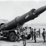 Historical black and white photo of 1960s Nike Hercules missile being deployed in South Korea with soldiers in uniform, vintage military atmosphere